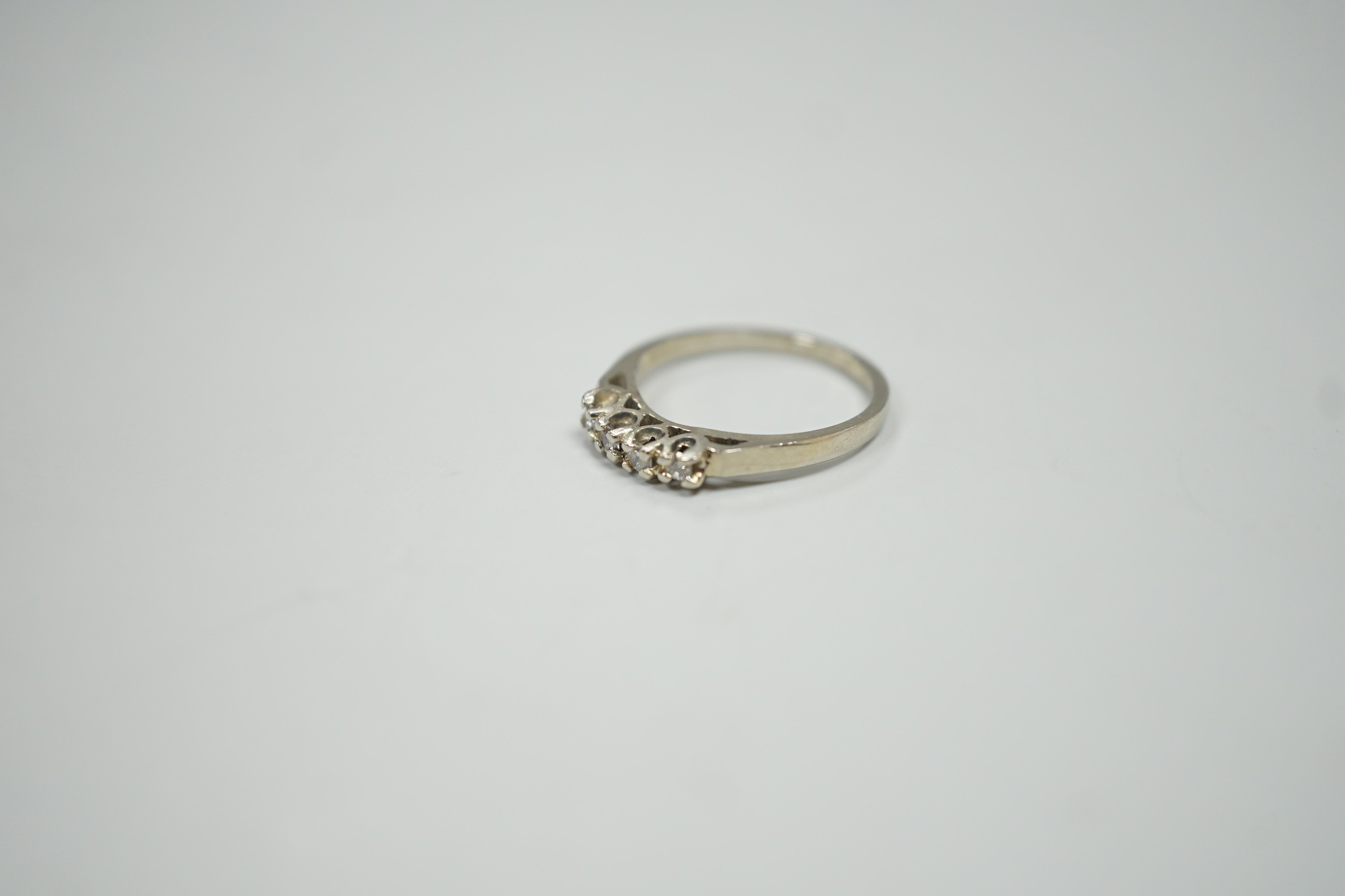 A Canadian Birks 18k white metal and four stone diamond set ring, size I, gross weight 1.8 grams.